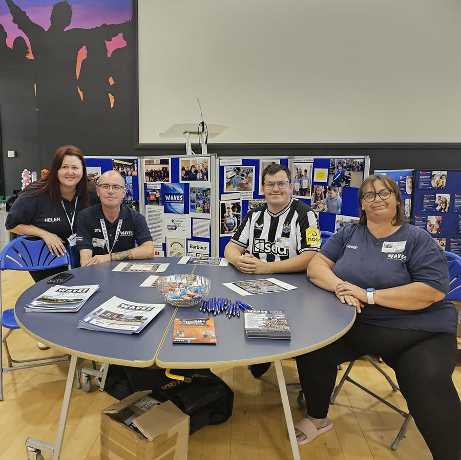 A group of people sat around a table.